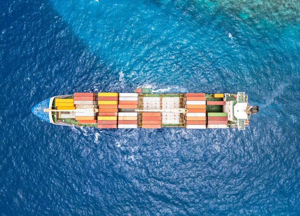 Container ship at sea, illustrative sea freight photograph by Bent Van Aeken