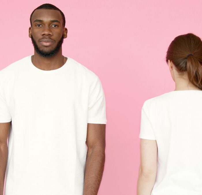 Illustrative reference of front and back views of white blank T-shirts on models, photo by Artem Podrez on Pexels; not a Grato factory sample
